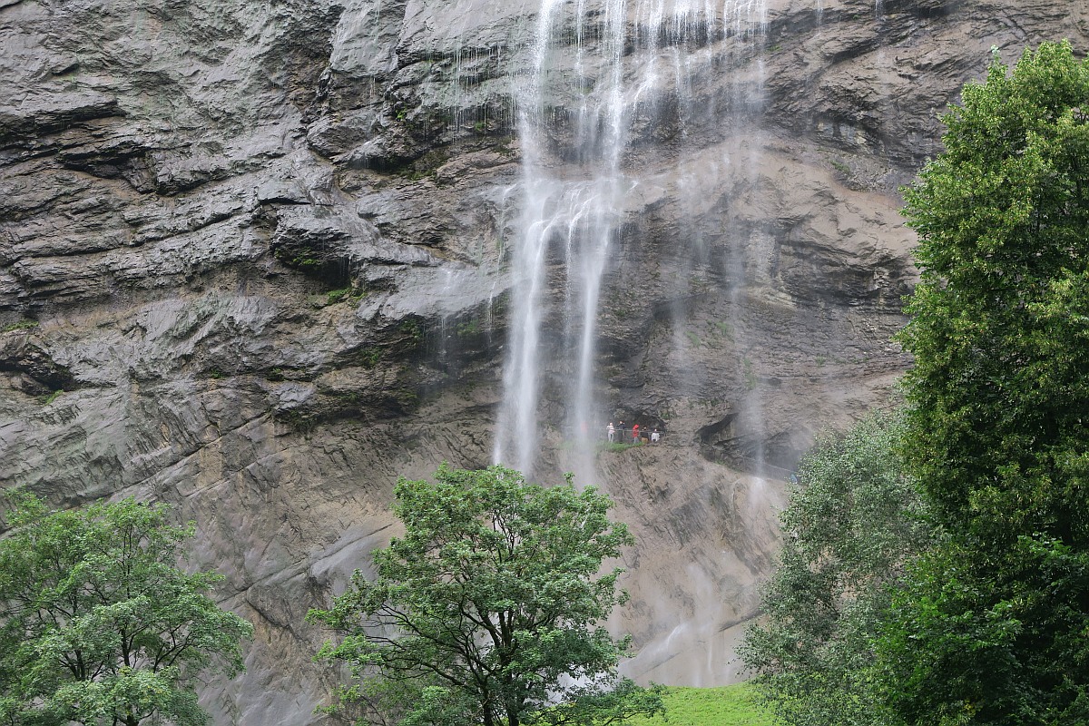 Can you spot the people behind Staubbach falls