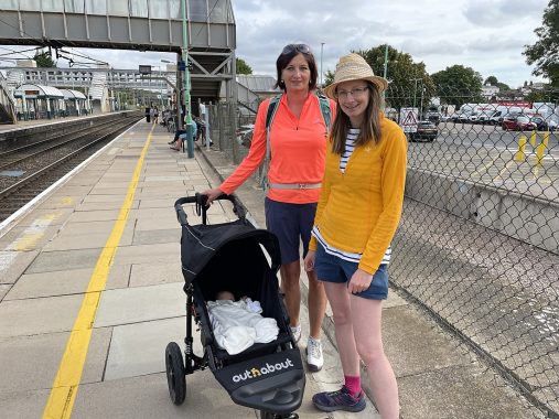 Waiting for the train with our Out n About buggy